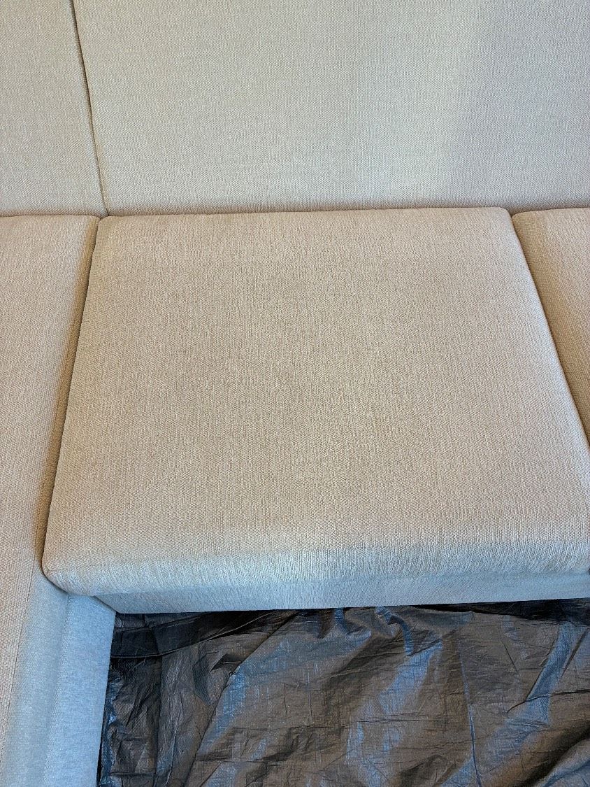 Light-colored couch cushion after upholstery cleaning and food-spot treatment in Clairemont