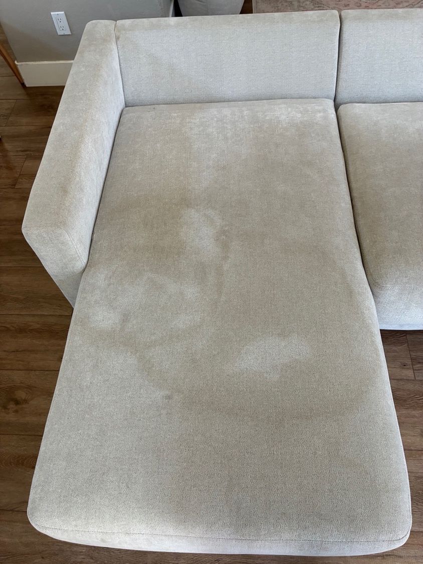 Light-colored sectional chaise with visible accumulated soil and discoloration before upholstery cleaning in Rancho Bernardo