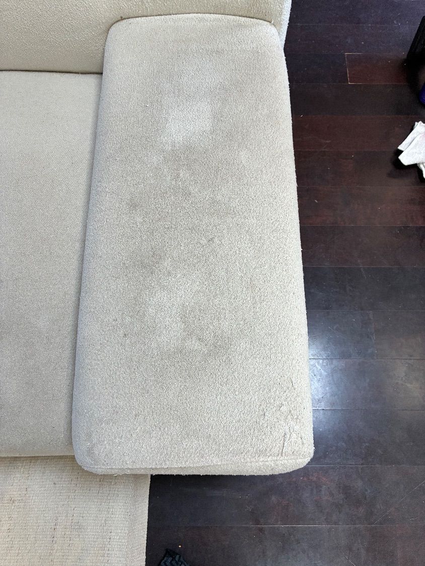 Heavily soiled white sectional with visible everyday-use spots before upholstery cleaning in Rancho Peñasquitos.